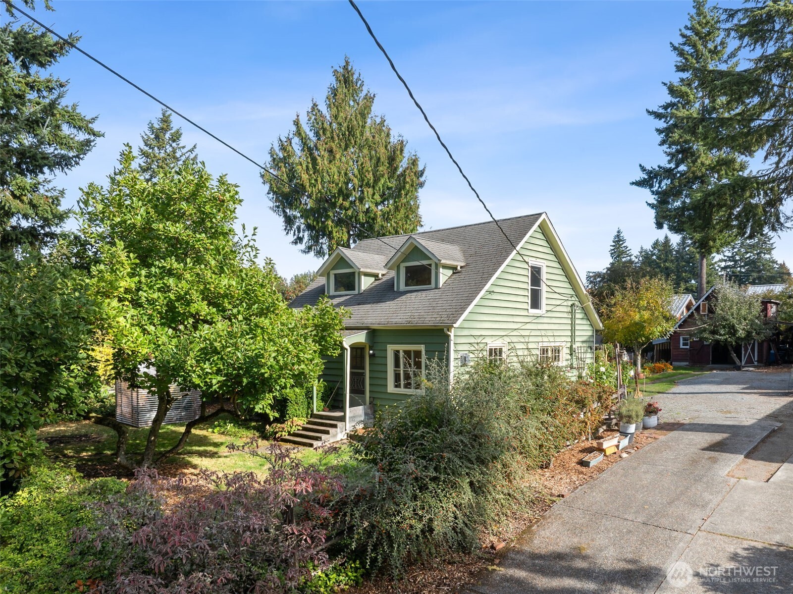 15620 21st Avenue Southwest Burien, WA 98166 - Photo 1 of 38 a front view of a house with a yard