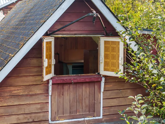 an aerial view of a houses with a yard