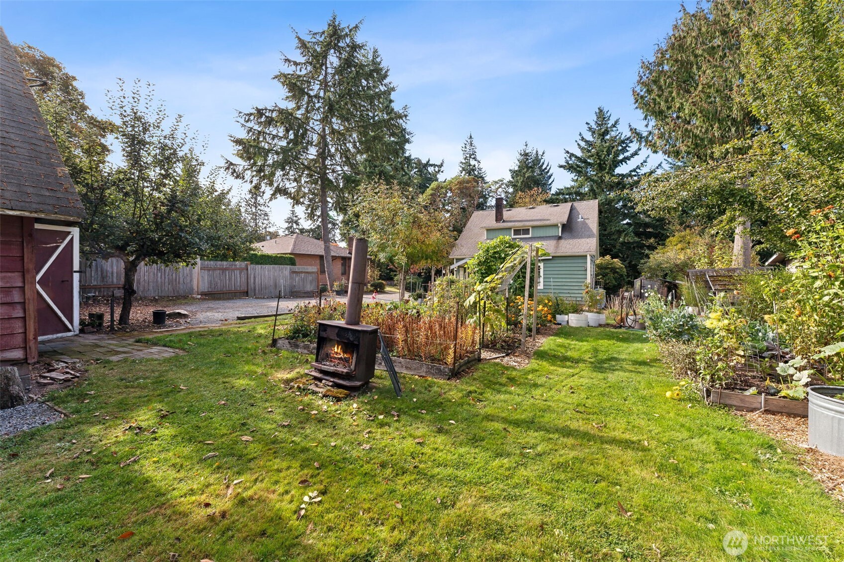 15620 21st Avenue Southwest Burien, WA 98166 - Photo 26 of 38 a view of a backyard with table and chairs