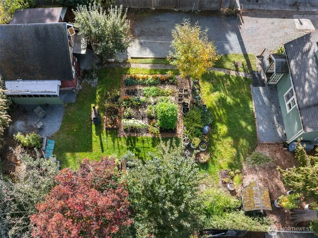 an aerial view of a house with a garden