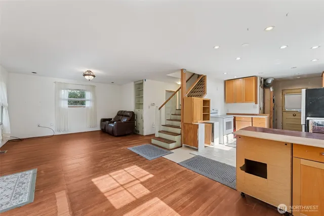 a view of a livingroom with furniture and a flat screen tv