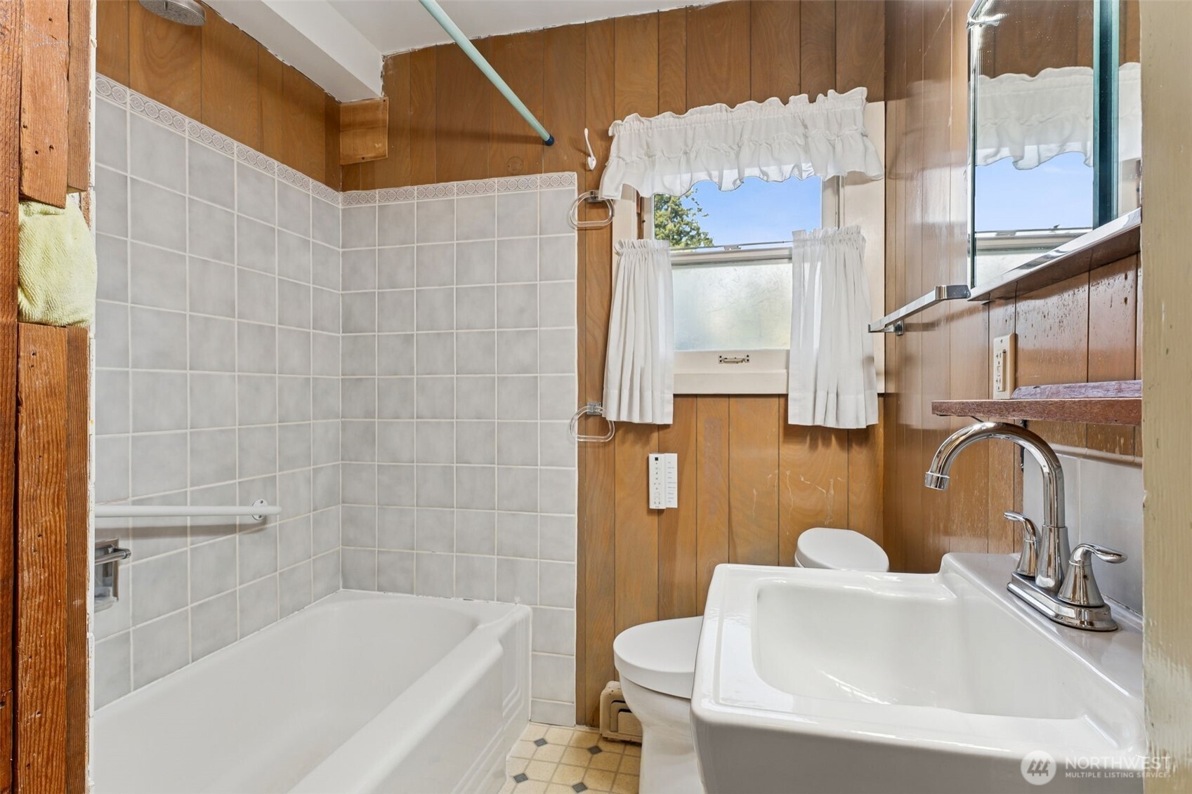 15620 21st Avenue Southwest Burien, WA 98166 - Photo 8 of 38 a bathroom with a sink and a bathtub