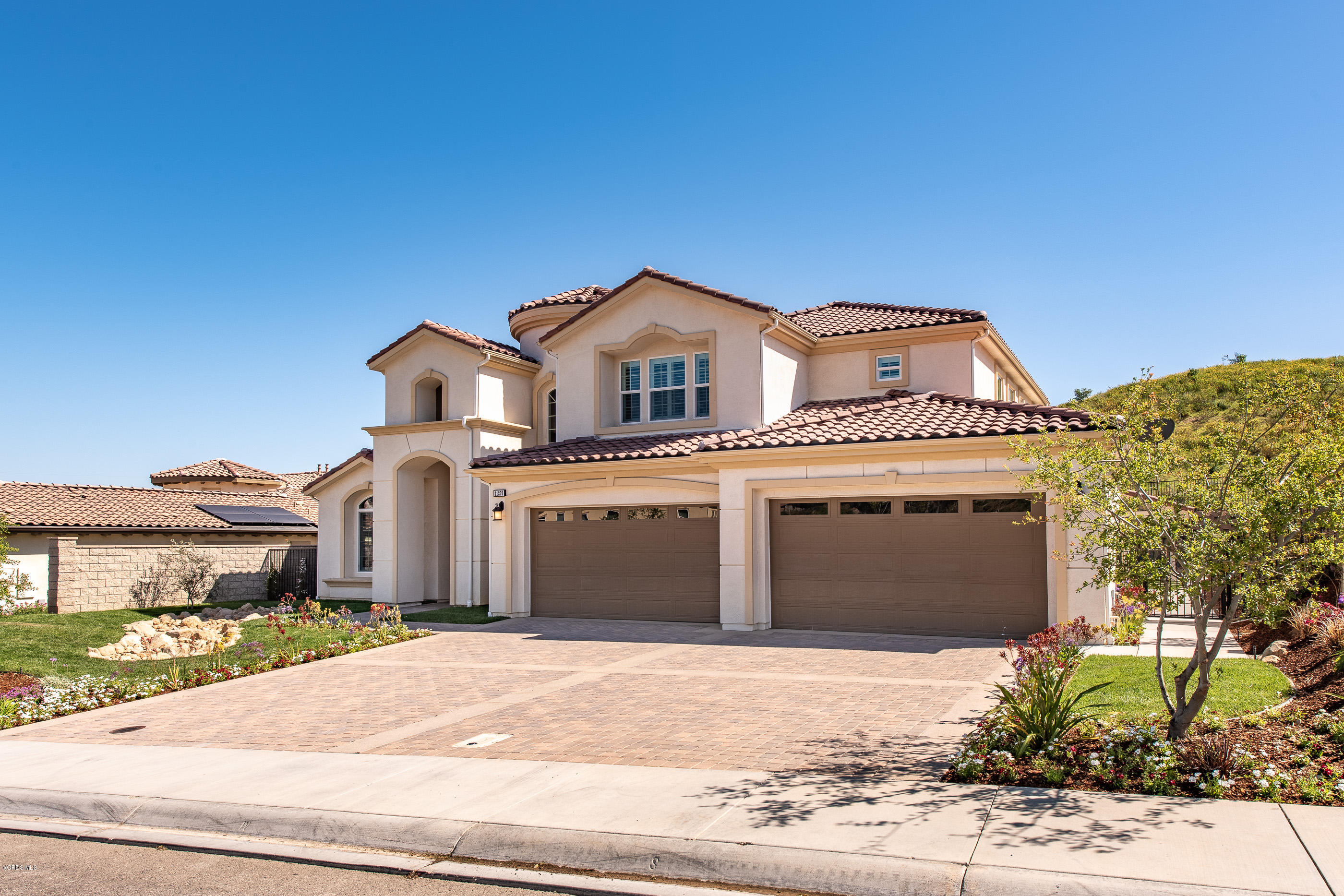 11276 Crenshaw Street Moorpark, CA 93021 - Photo 2 of 52 a front view of a house with a garden