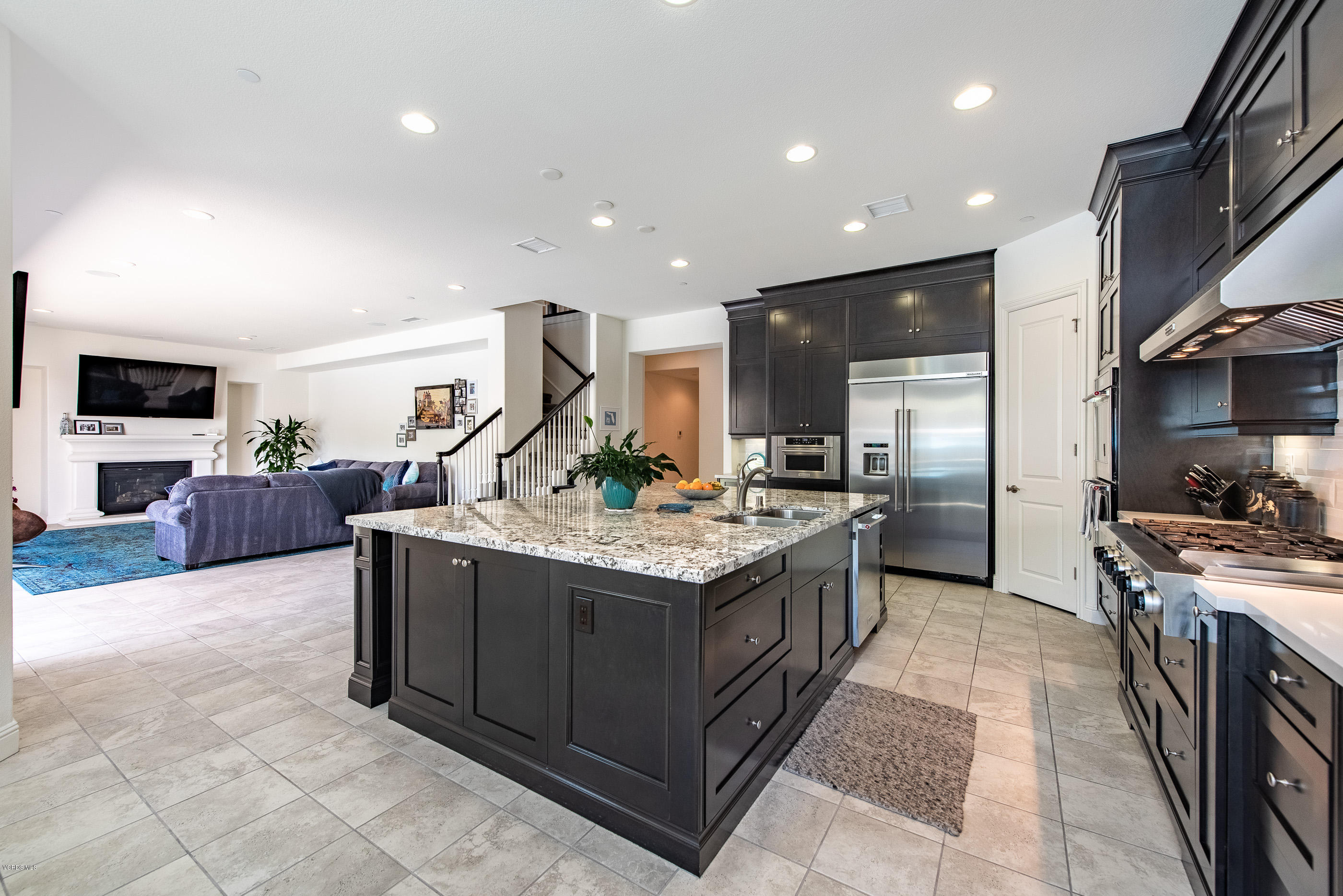 11276 Crenshaw Street Moorpark, CA 93021 - Photo 13 of 52 a kitchen with stainless steel appliances granite countertop a stove and a sink