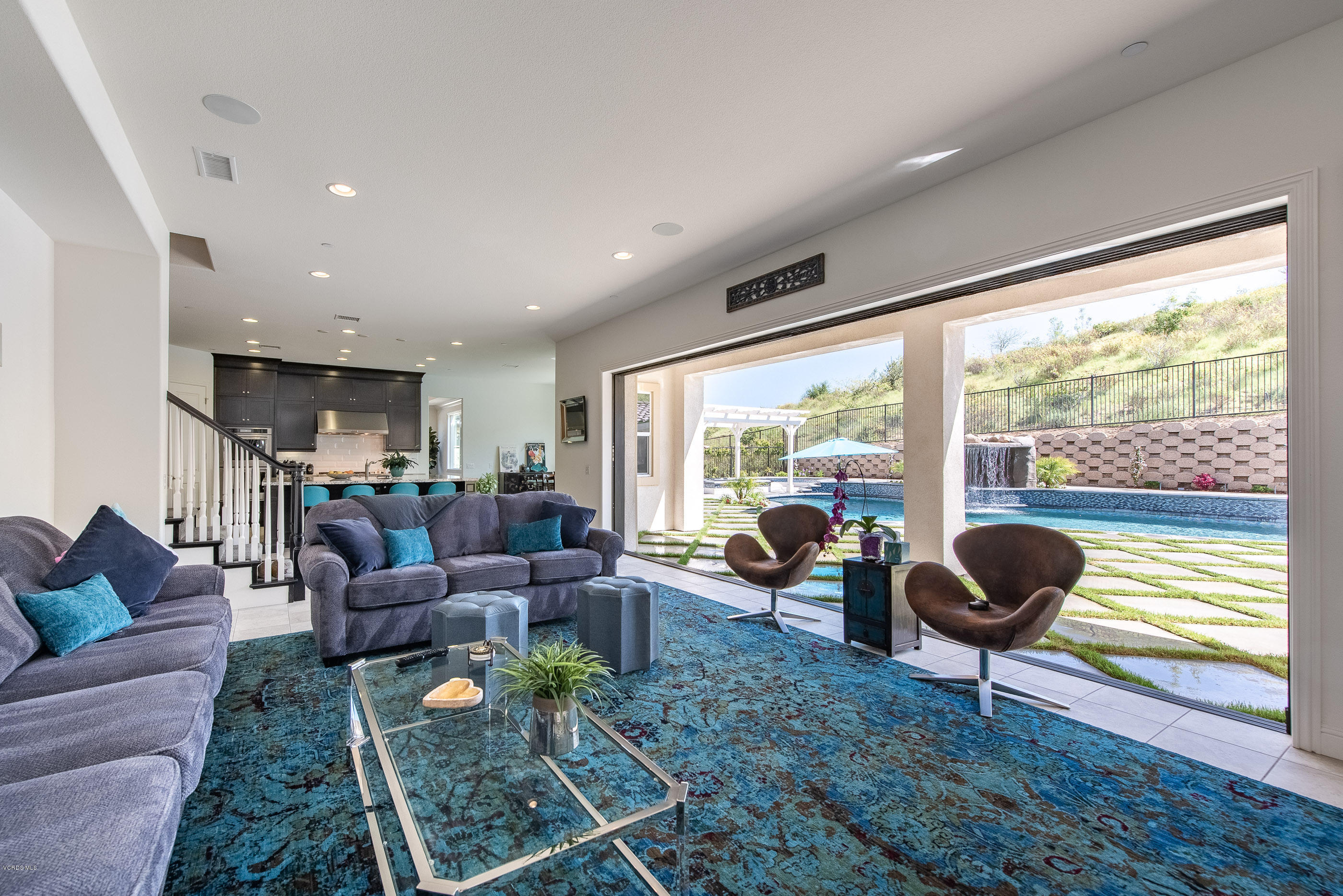 11276 Crenshaw Street Moorpark, CA 93021 - Photo 21 of 52 a living room with furniture and a floor to ceiling window