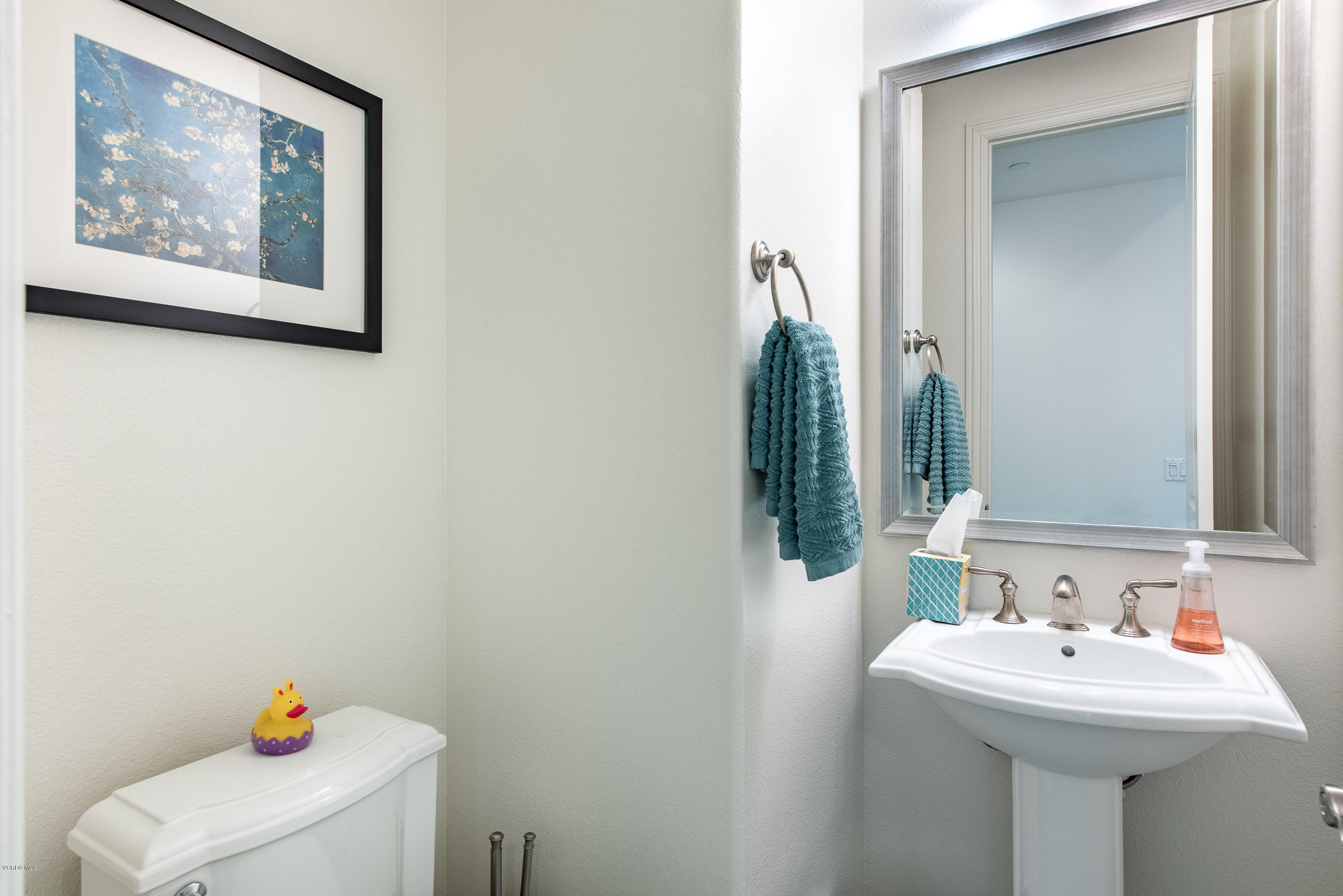 11276 Crenshaw Street Moorpark, CA 93021 - Photo 24 of 52 a bathroom with a sink and a mirror