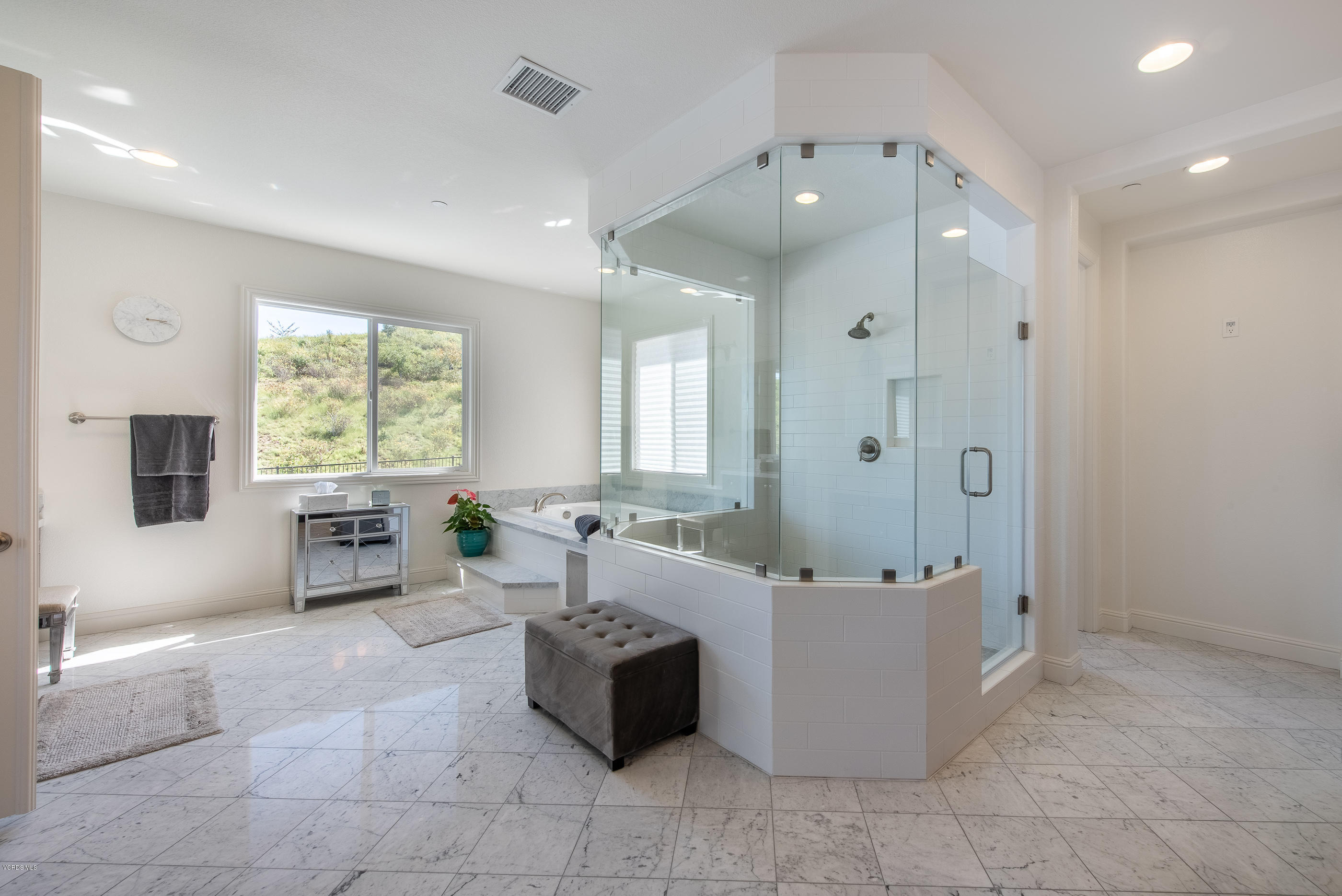 11276 Crenshaw Street Moorpark, CA 93021 - Photo 31 of 52 a spacious bathroom with a tub sink and mirror