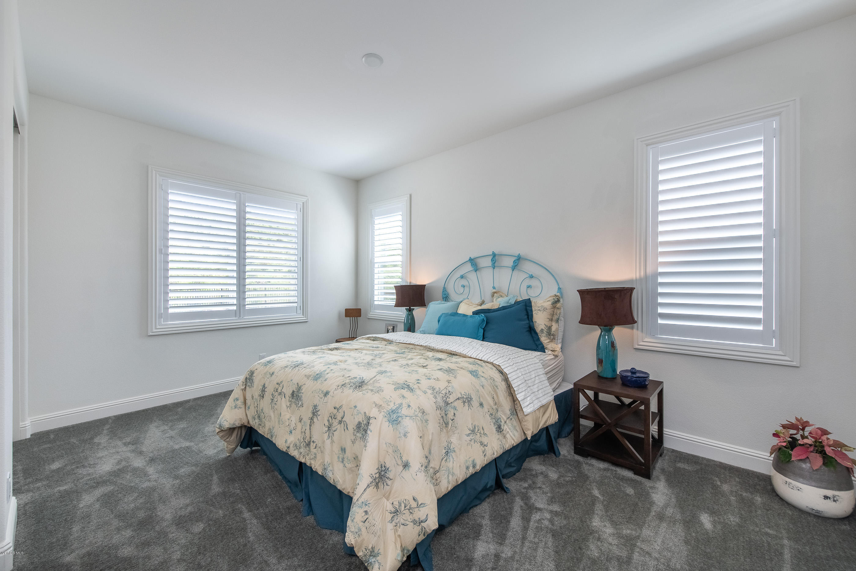 11276 Crenshaw Street Moorpark, CA 93021 - Photo 36 of 52 a bedroom with a bed and a window