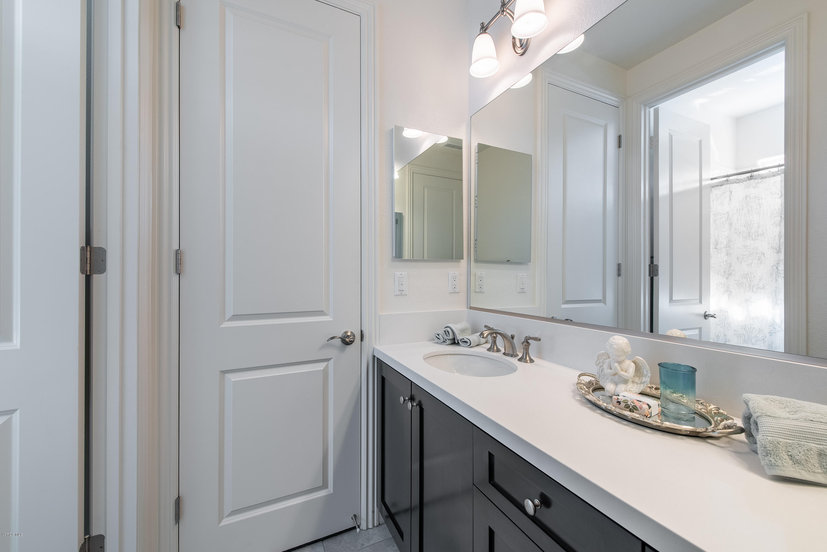 11276 Crenshaw Street Moorpark, CA 93021 - Photo 37 of 52 a bathroom with a sink and a mirror