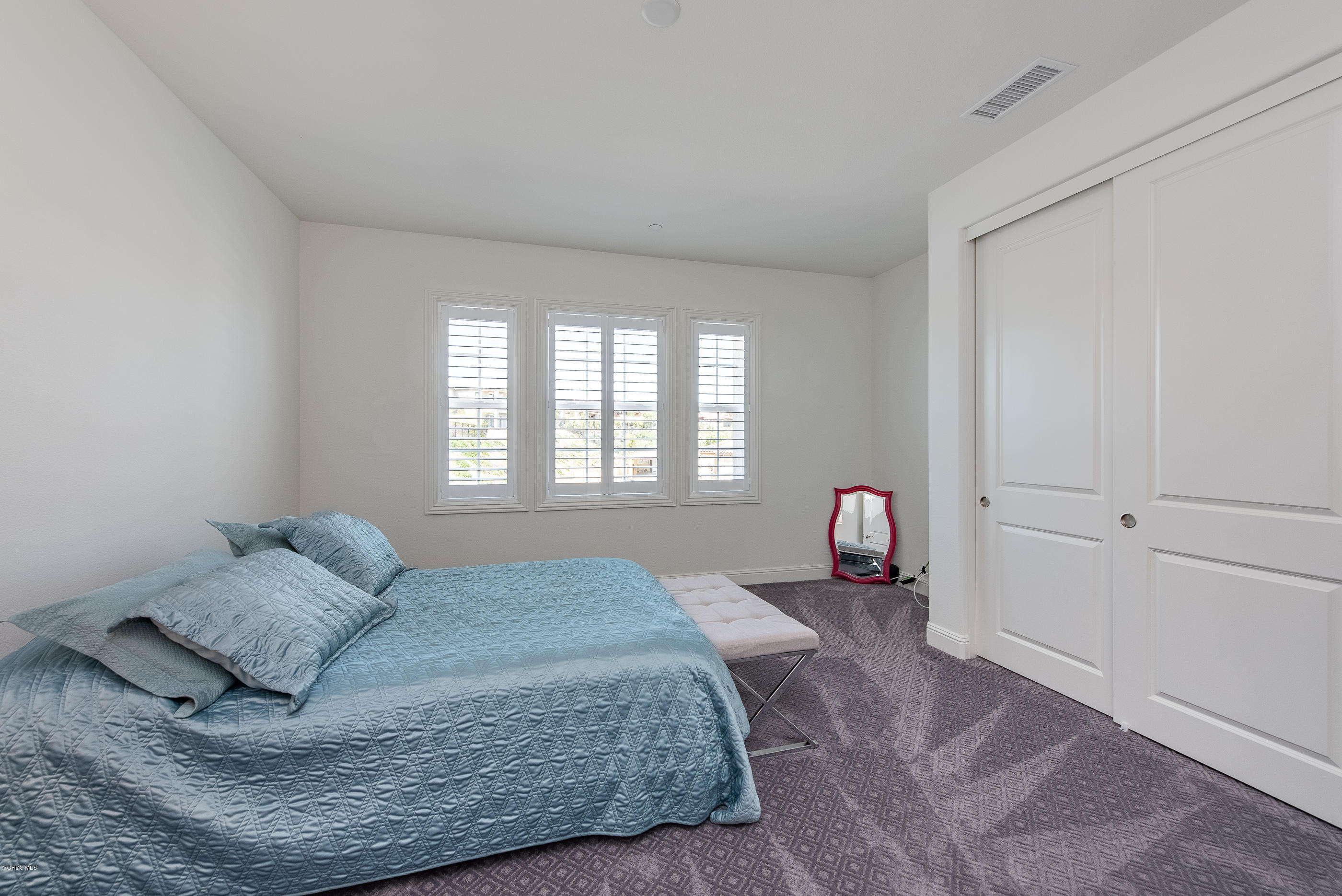 11276 Crenshaw Street Moorpark, CA 93021 - Photo 41 of 52 a bedroom with a bed and window