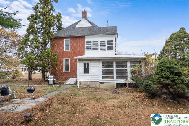 a kitchen with granite countertop a refrigerator stove top oven and sink