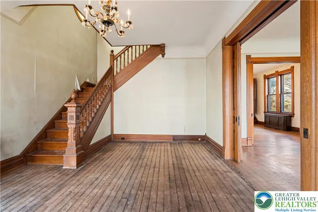 a view of an entryway with wooden floor