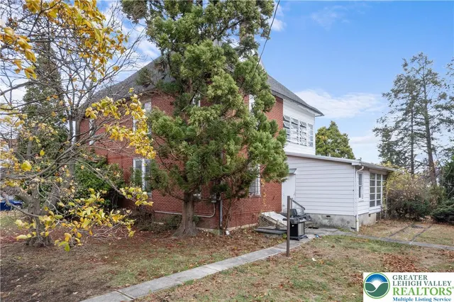 an aerial view of a house with garden space