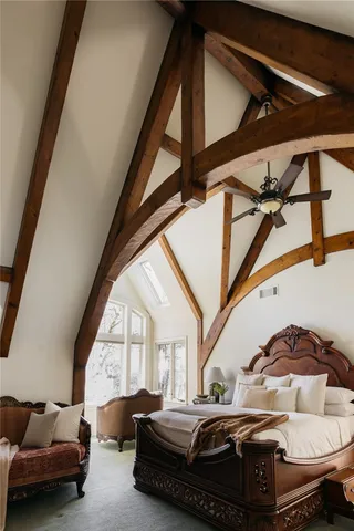 a bedroom with furniture and a window