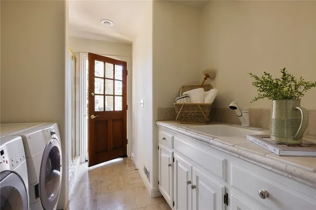 a bedroom with a bed and a potted plant