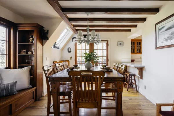 a view of a dining room with furniture and window