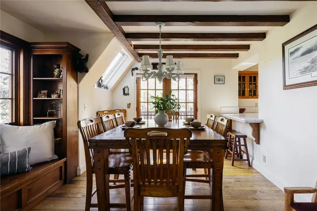 a view of a dining room with furniture and window