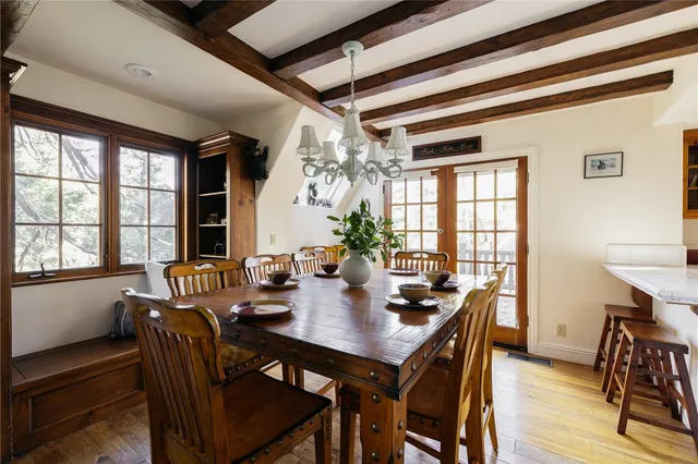 a view of a dining room with furniture window and outside view