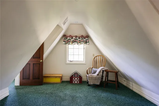 a room with a bed and a chandelier