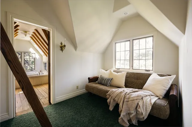 a bedroom with bed and a window