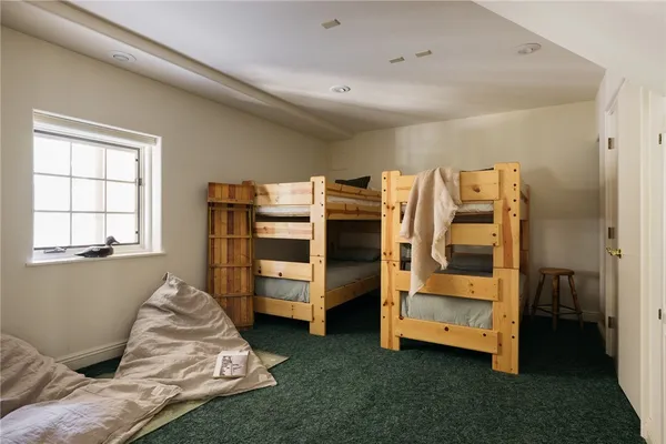 a bed room with a bed and a window