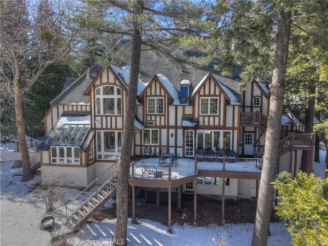 a front view of a house with a garden and patio