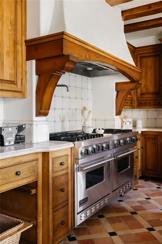 a kitchen with a stove and a sink