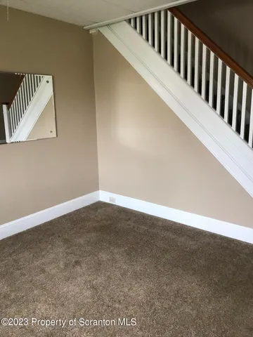 a view of staircase with wooden floor