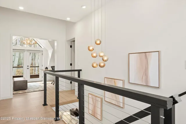 a view of a hallway with seating area