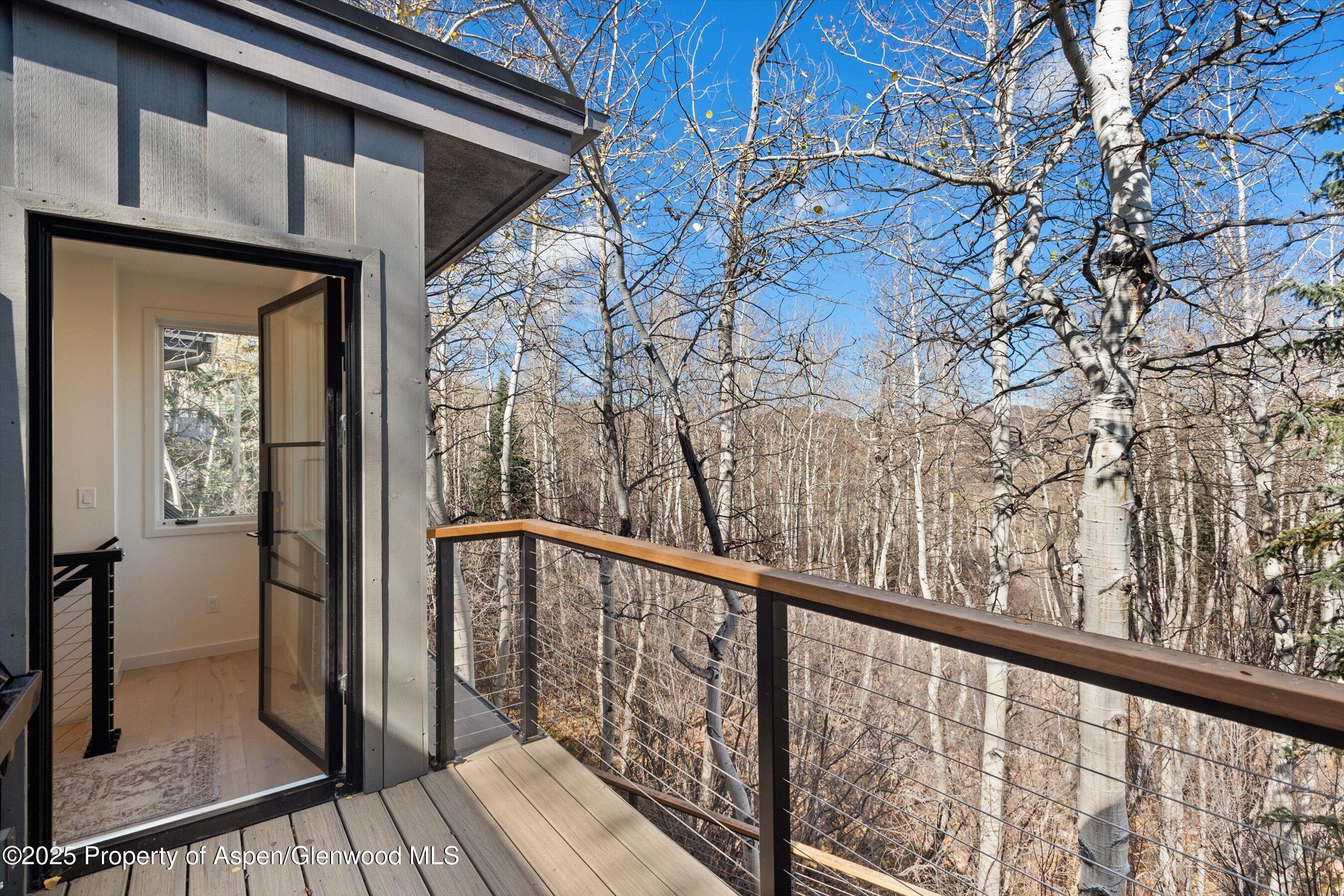 626 Faraway Road Snowmass Village, CO 81615 - Photo 13 of 23 a view of a balcony with wooden floor