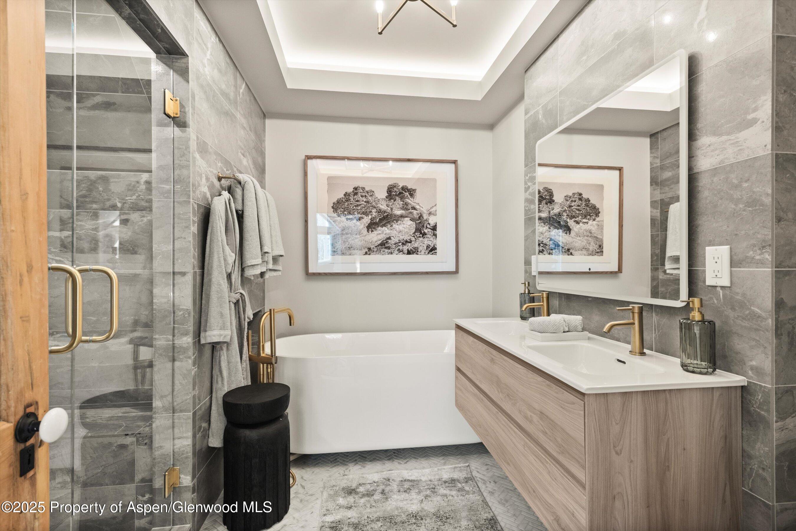 626 Faraway Road Snowmass Village, CO 81615 - Photo 17 of 23 a bathroom with a double vanity sink and a mirror