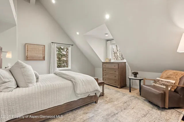 a bedroom with a bed and furniture