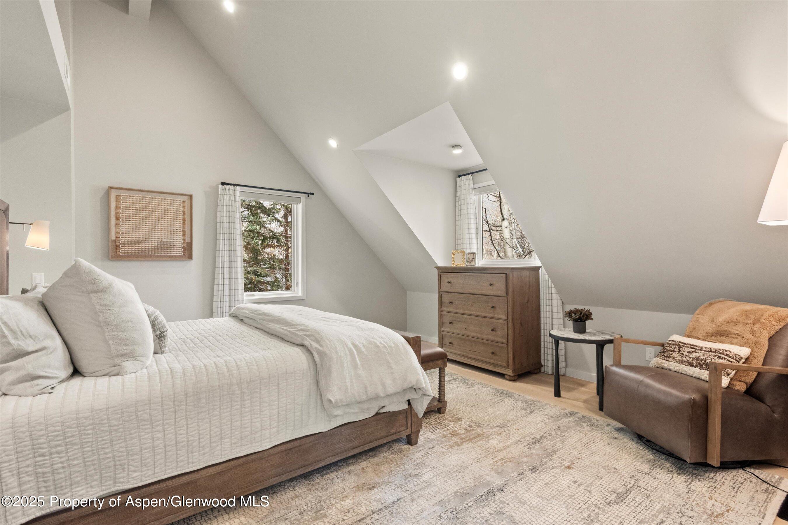 626 Faraway Road Snowmass Village, CO 81615 - Photo 18 of 23 a bedroom with a bed and furniture