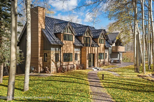 a view of a brick building next to a yard