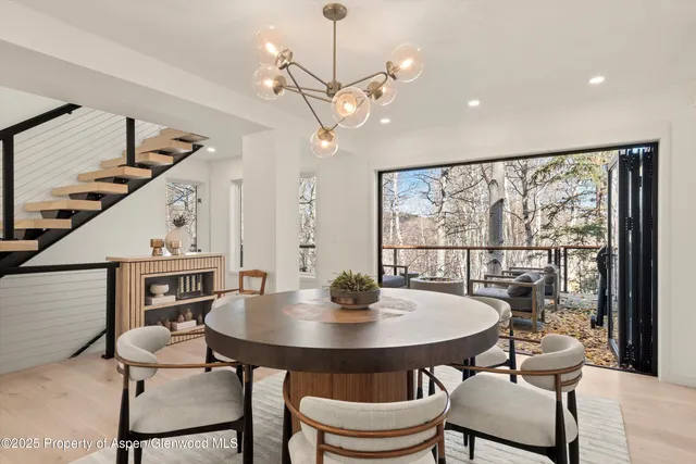 a view of a dining room with furniture window and wooden floor