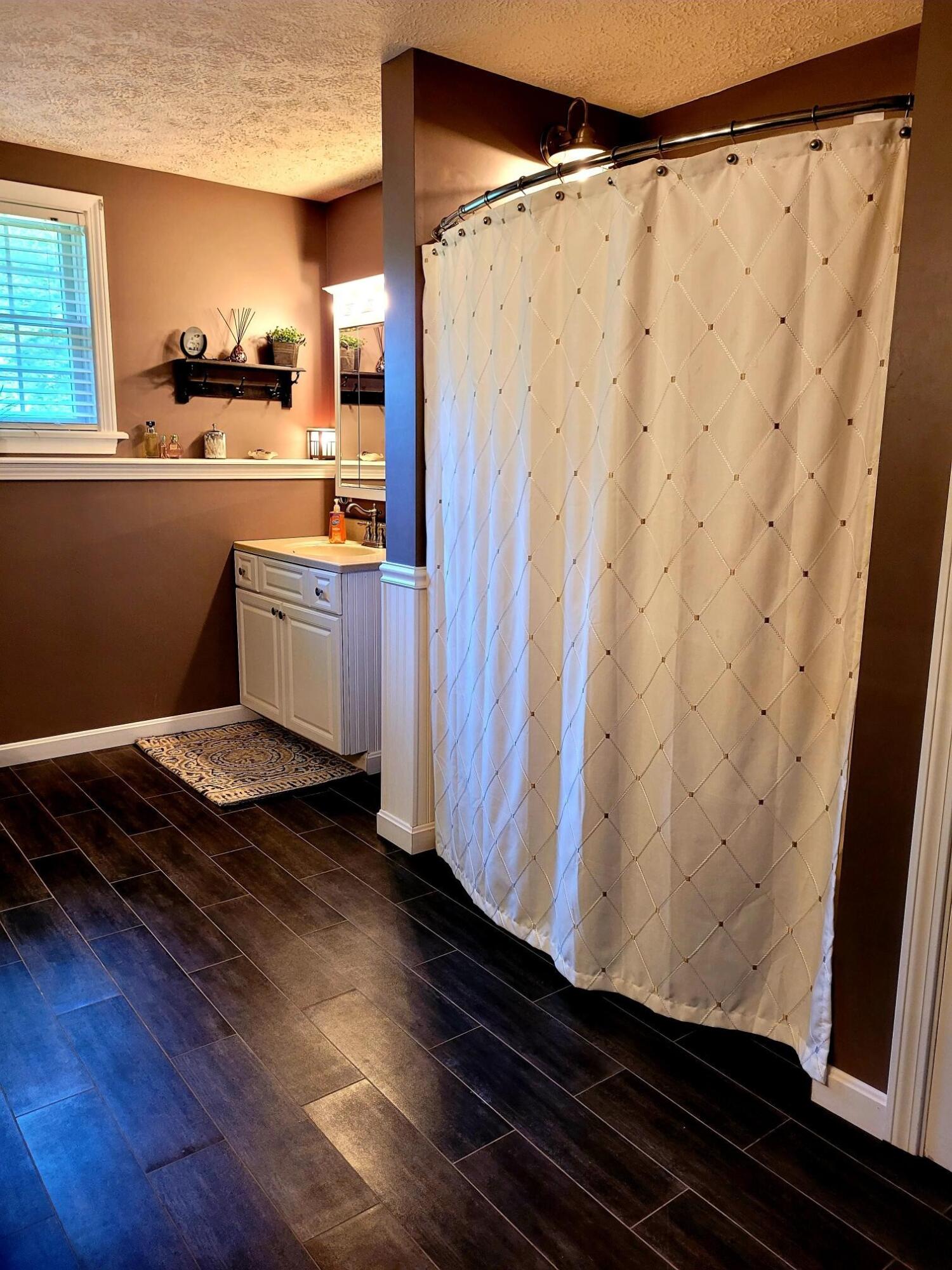 155 Kidder Road South China, ME 04358 - Photo 37 of 68 Radiant heat in bath!