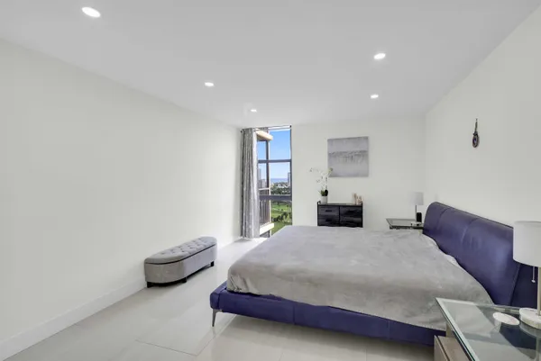 a bedroom with a bed and a couch