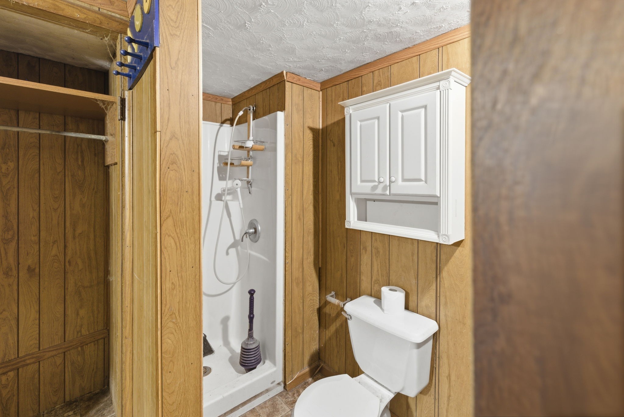 207 Center Street Portland, TN 37148 - Photo 20 of 26 a bathroom with a toilet and a shower