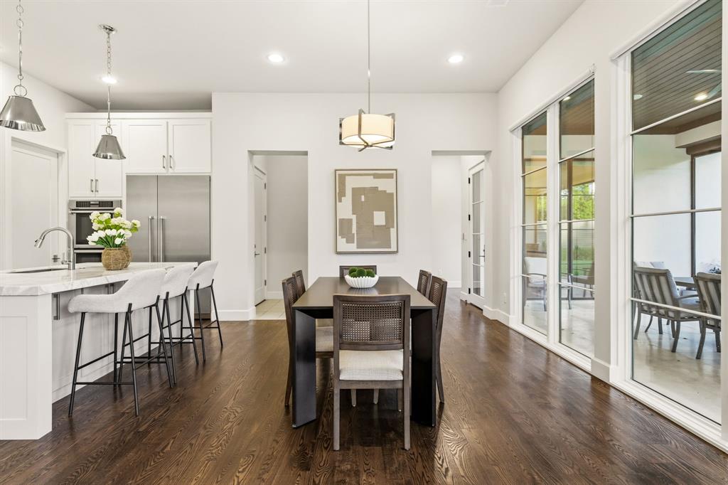 6523 Northwood Road Dallas, TX 75225 - Photo 10 of 36 a view of a dining room with furniture window and wooden floor