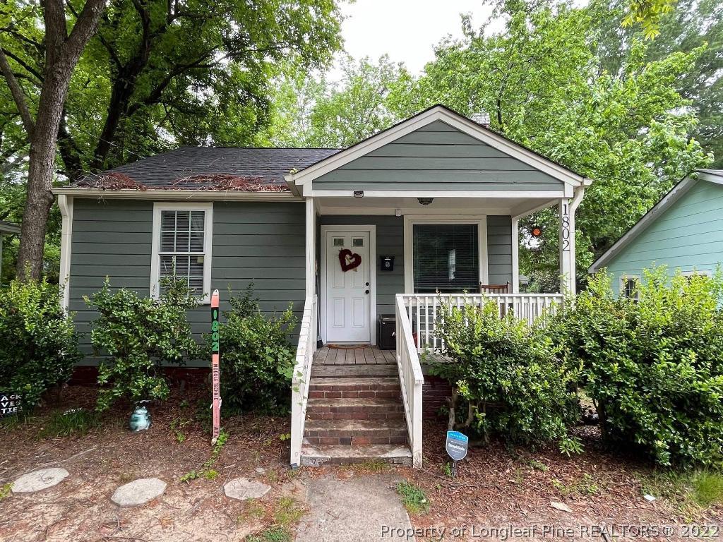 1802 Guess Road Durham, NC 27705 - Photo 2 of 9 a front view of a house with a garden