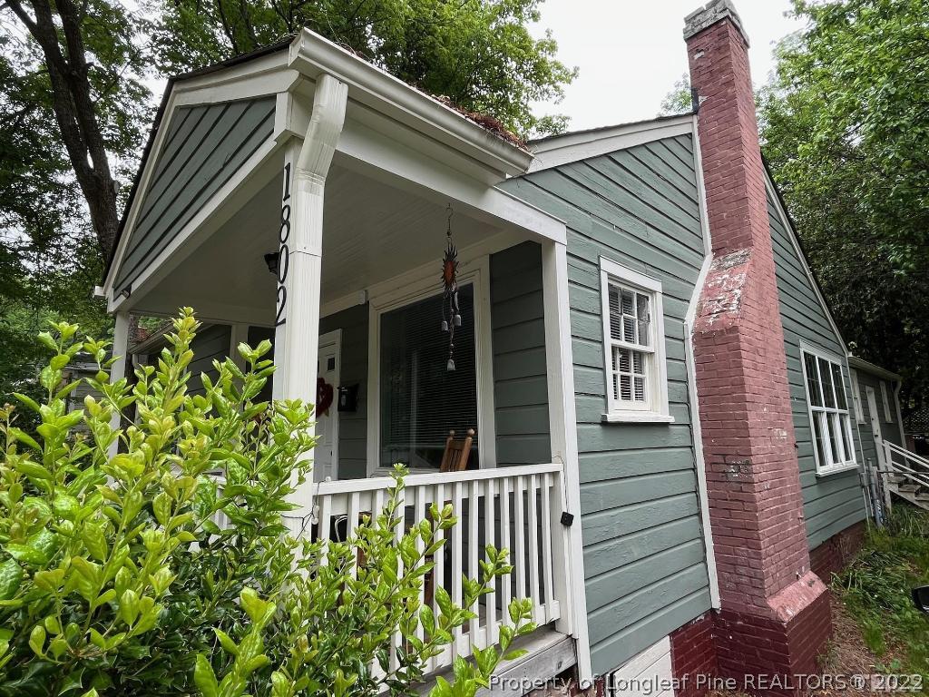 1802 Guess Road Durham, NC 27705 - Photo 3 of 9 a view of a house with a flower garden