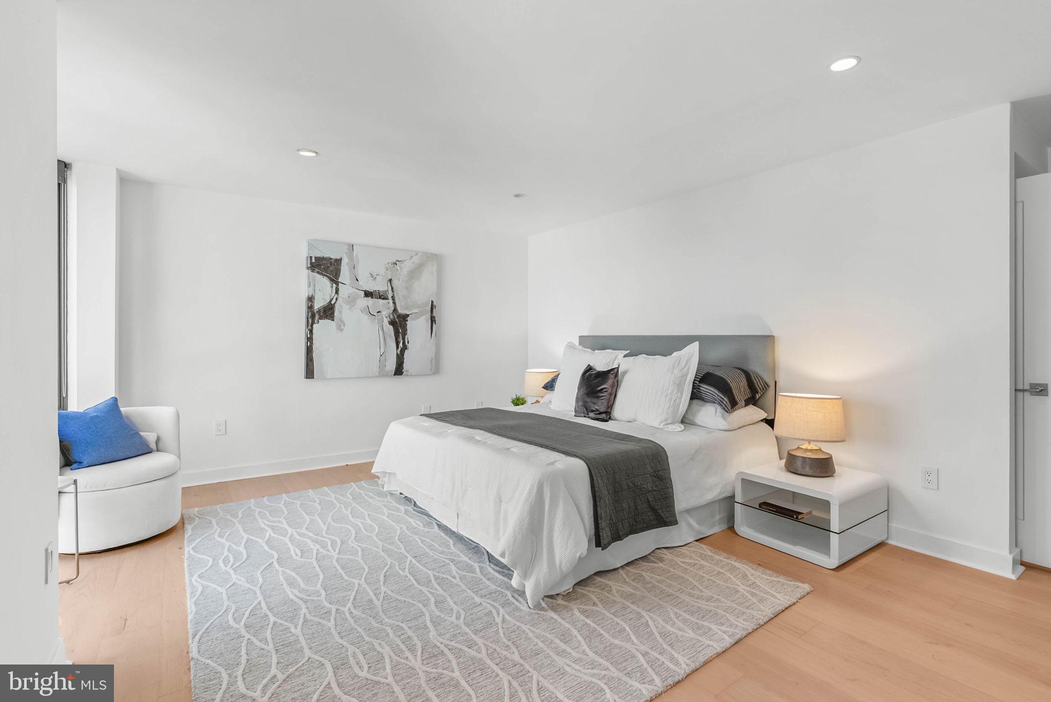 2018 Walnut Street, Unit 2018 Philadelphia, PA 19103 - Photo 24 of 52 a bedroom with a bed and a couch
