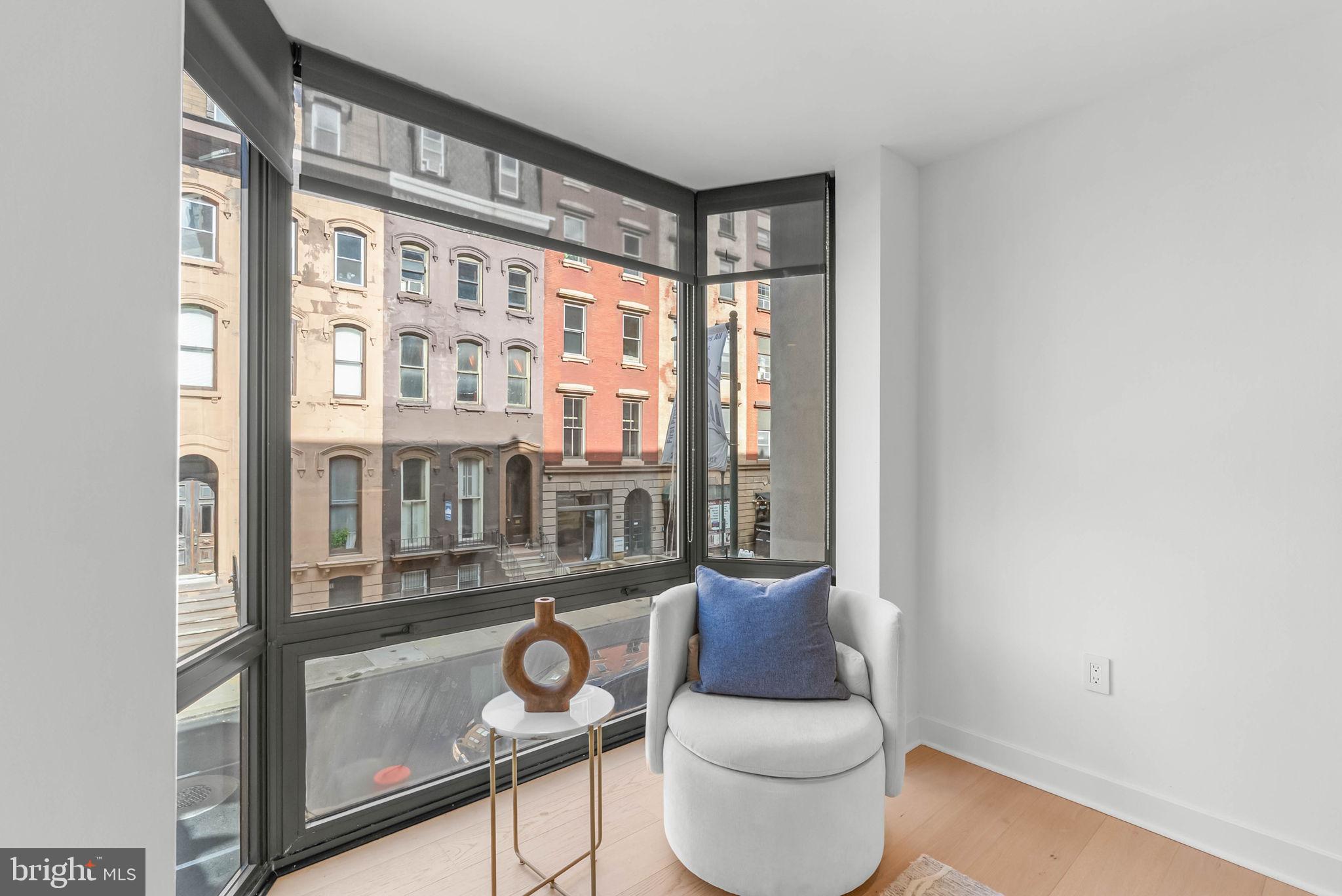 2018 Walnut Street, Unit 2018 Philadelphia, PA 19103 - Photo 26 of 52 a living room with furniture and a window