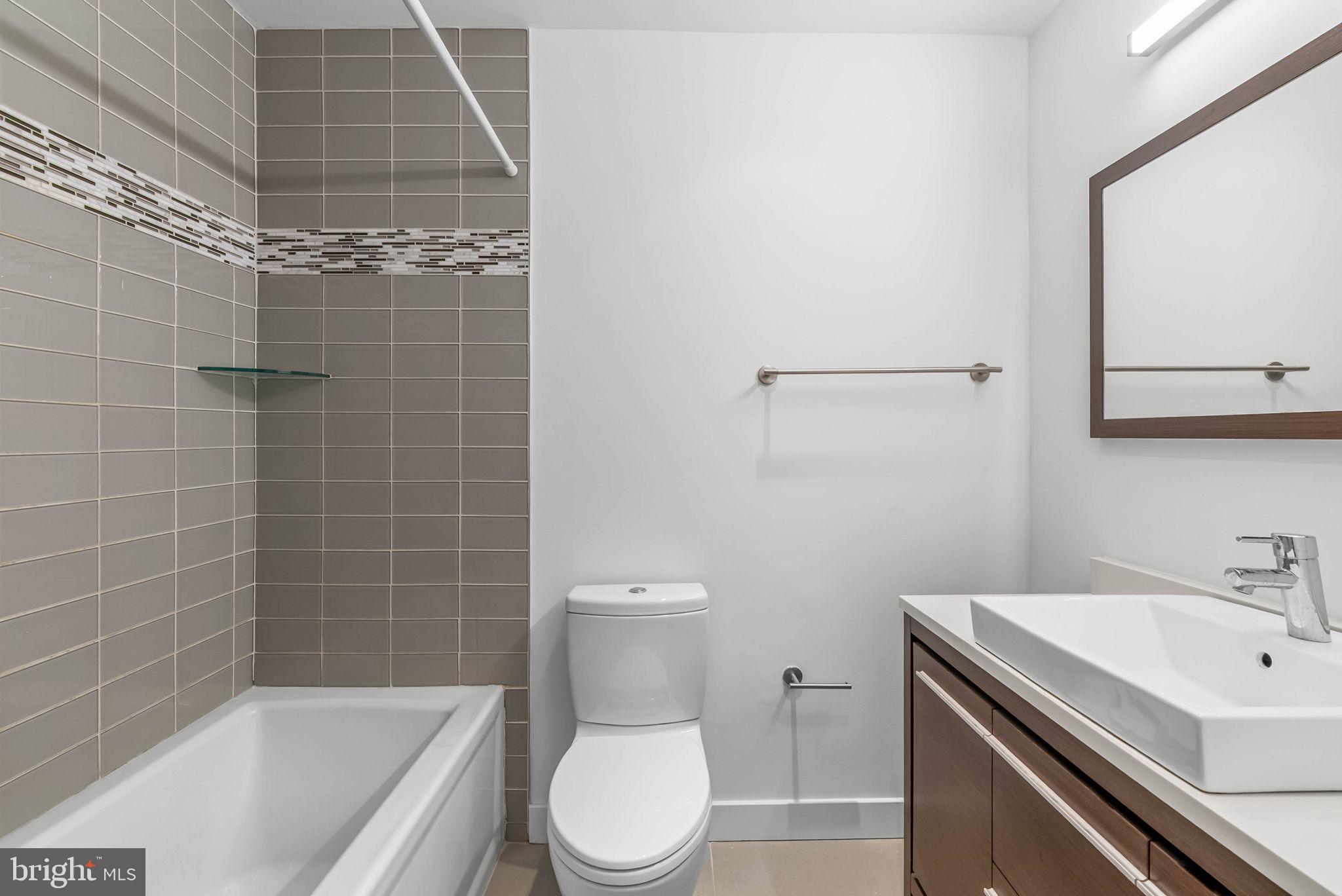 2018 Walnut Street, Unit 2018 Philadelphia, PA 19103 - Photo 31 of 52 a bathroom with a sink a toilet and shower