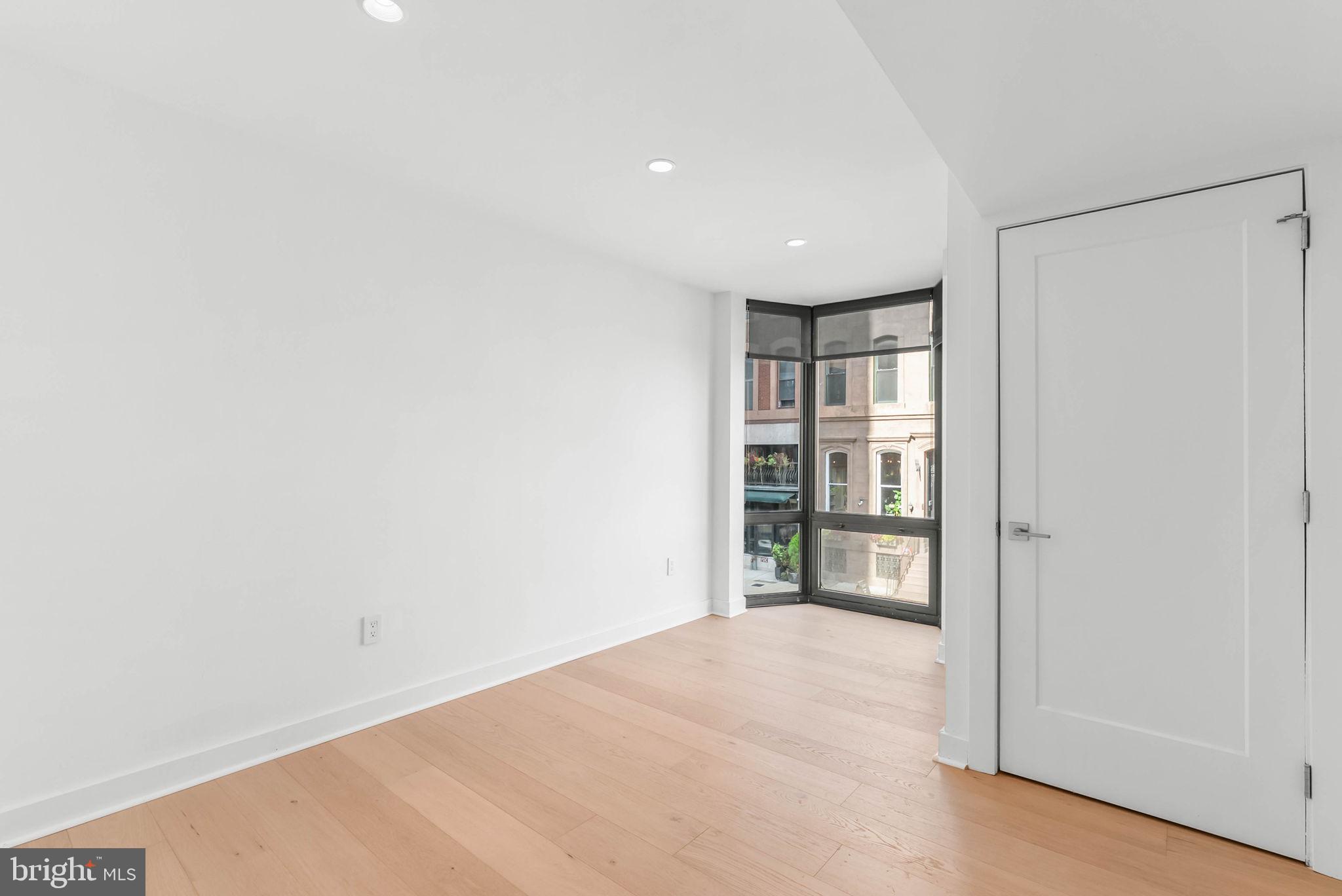 2018 Walnut Street, Unit 2018 Philadelphia, PA 19103 - Photo 32 of 52 a view of an empty room with a window