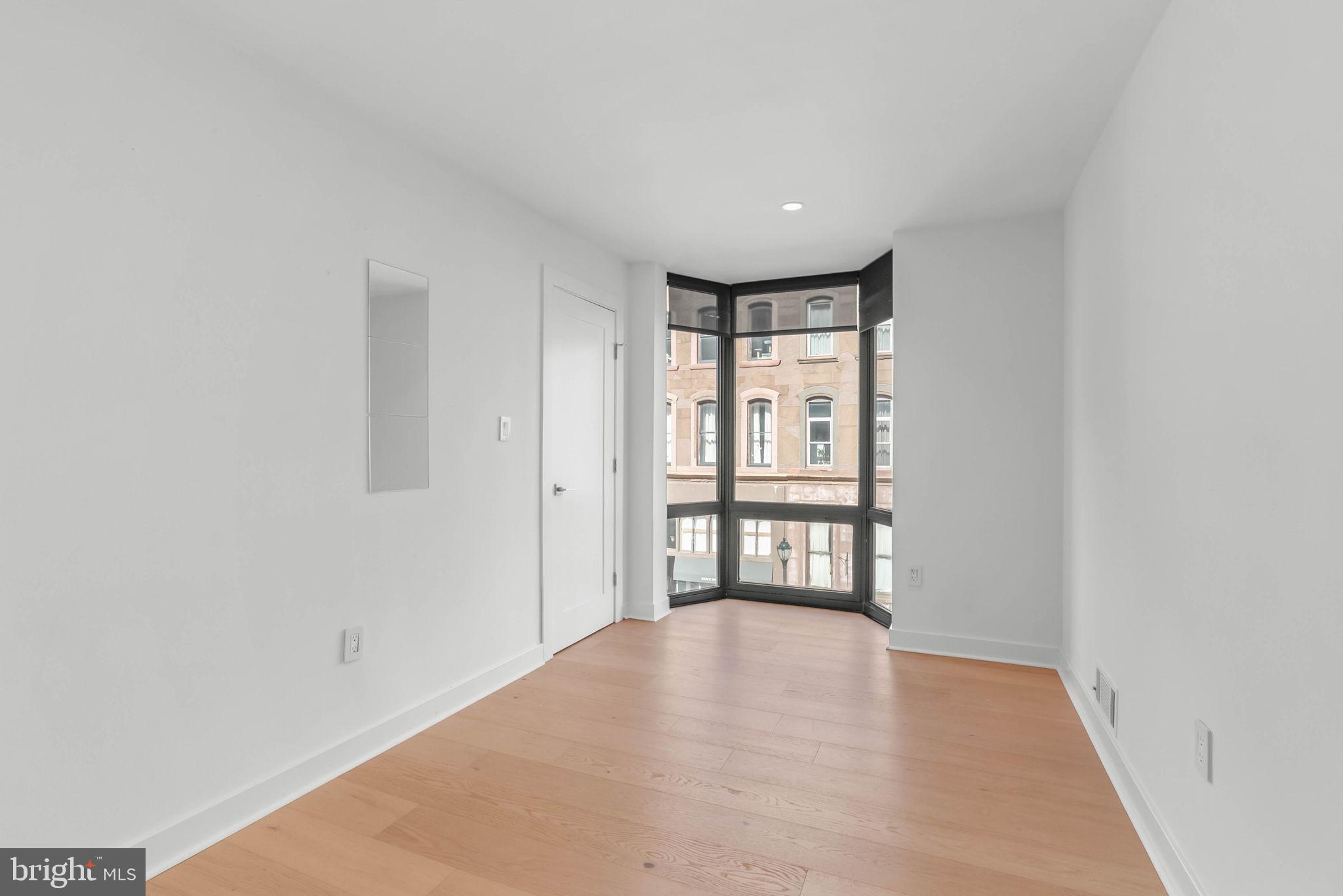 2018 Walnut Street, Unit 2018 Philadelphia, PA 19103 - Photo 36 of 52 a view of an empty room with a window