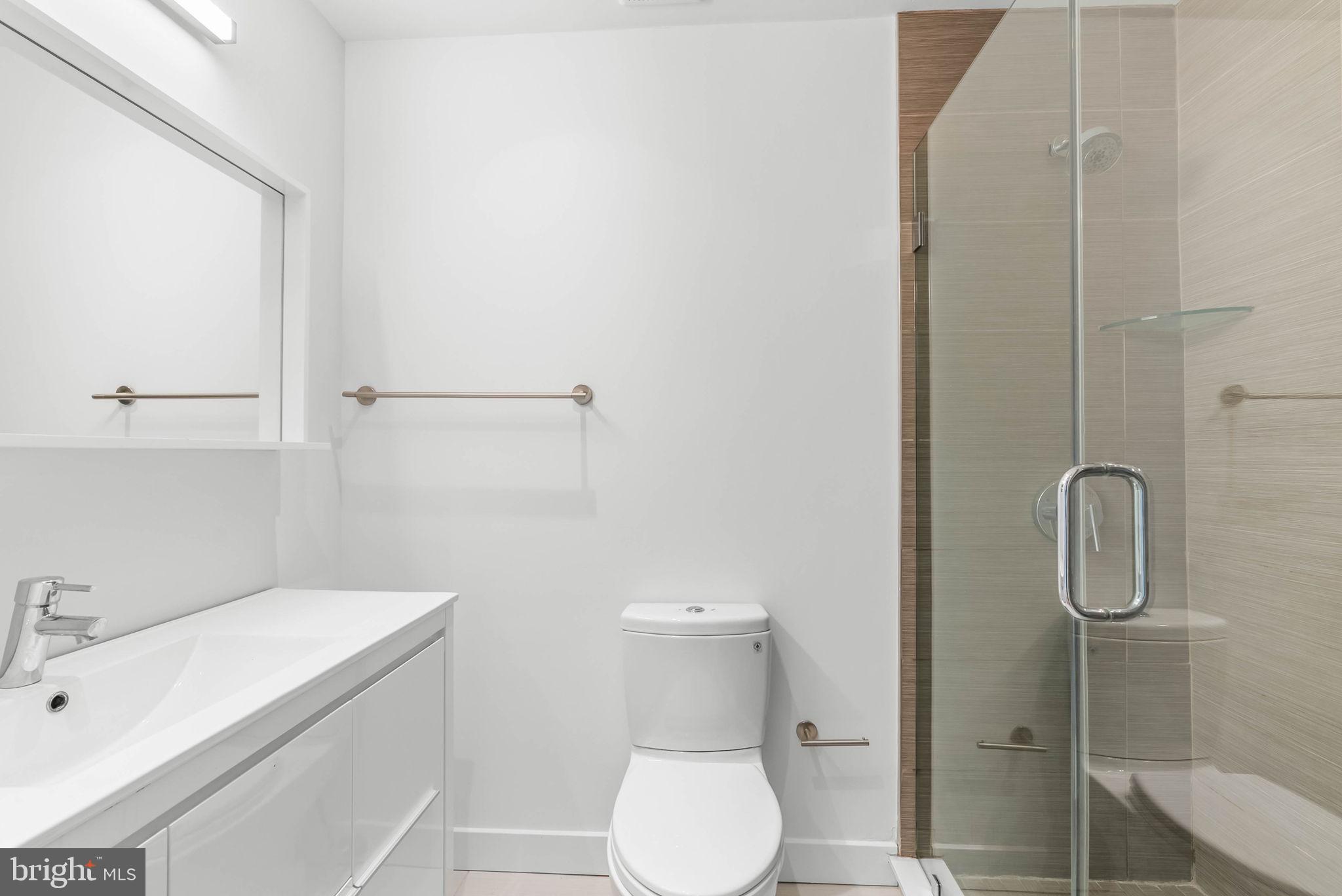 2018 Walnut Street, Unit 2018 Philadelphia, PA 19103 - Photo 38 of 52 a bathroom with a sink toilet and shower