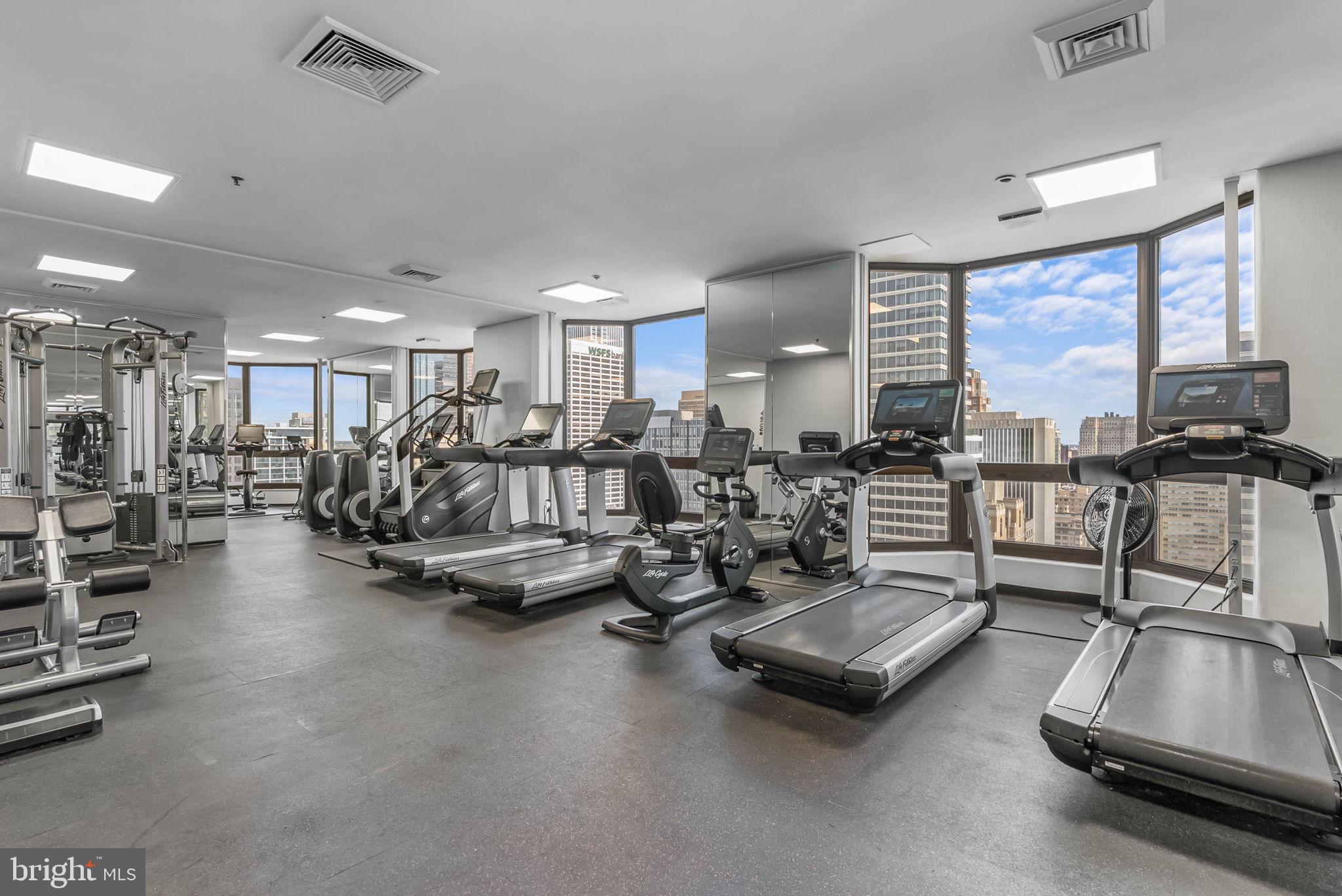 2018 Walnut Street, Unit 2018 Philadelphia, PA 19103 - Photo 44 of 52 a room with gym equipment and a large window
