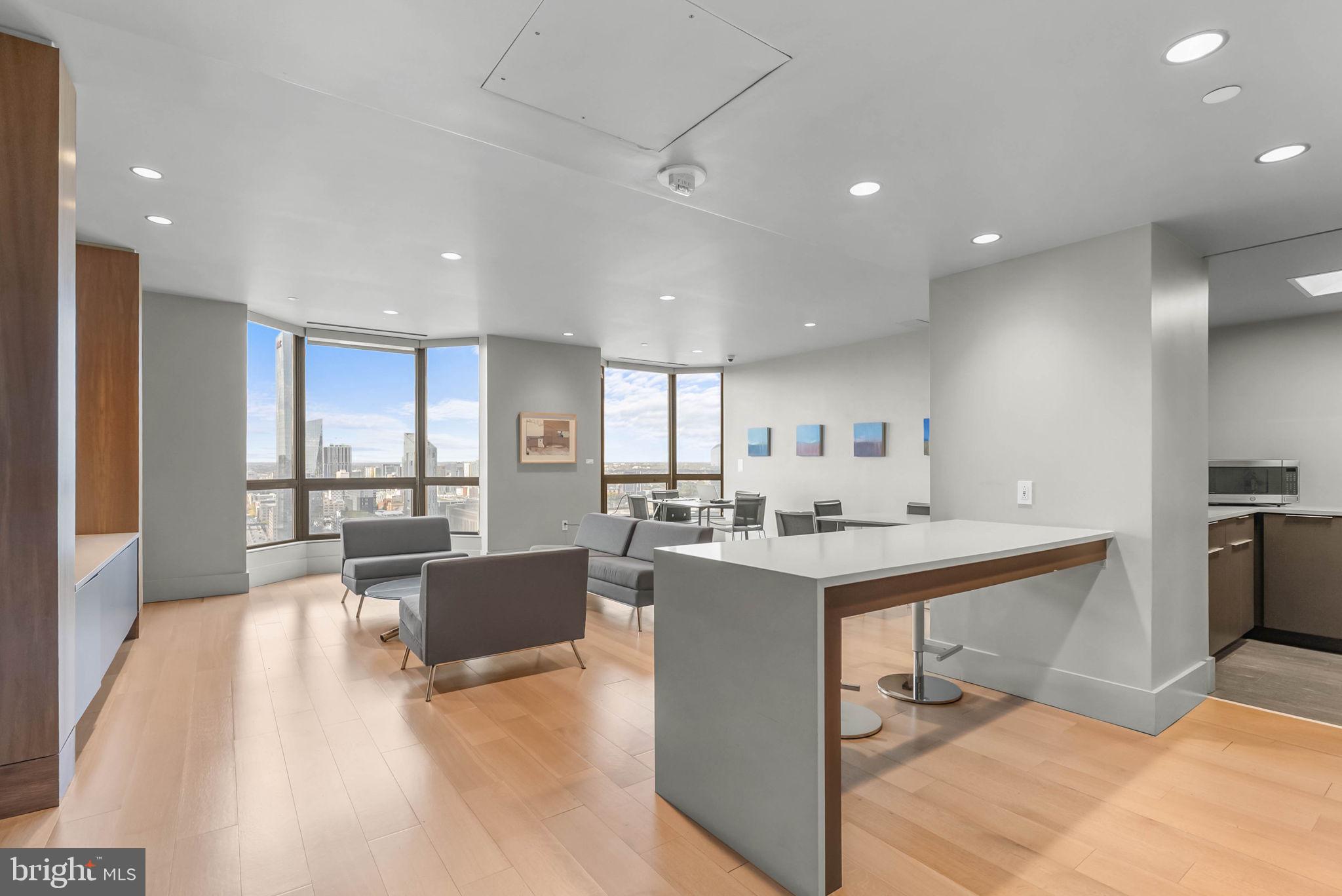 2018 Walnut Street, Unit 2018 Philadelphia, PA 19103 - Photo 50 of 52 a view of a living room and kitchen with a large window