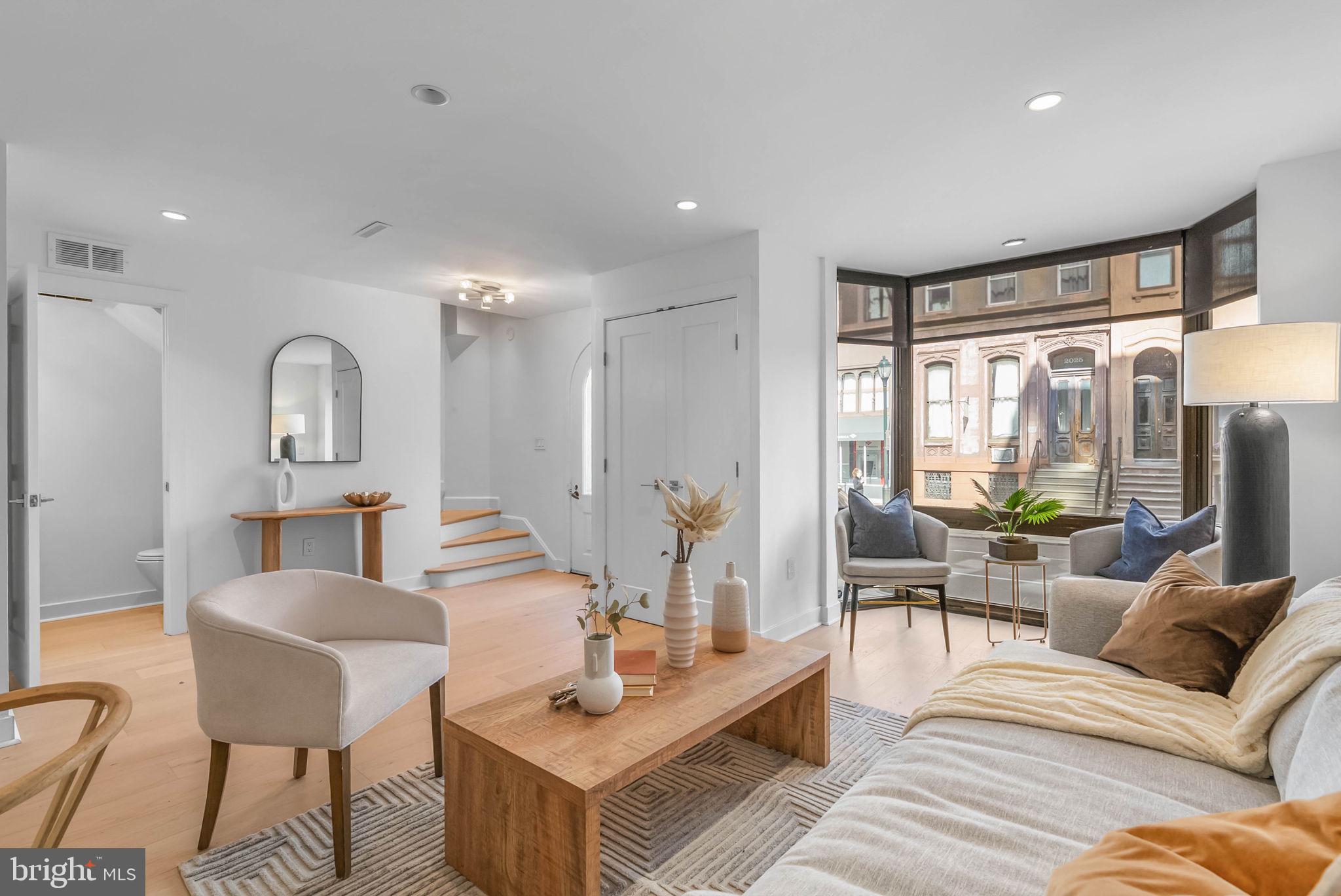 2018 Walnut Street, Unit 2018 Philadelphia, PA 19103 - Photo 8 of 52 a living room with furniture and a large window